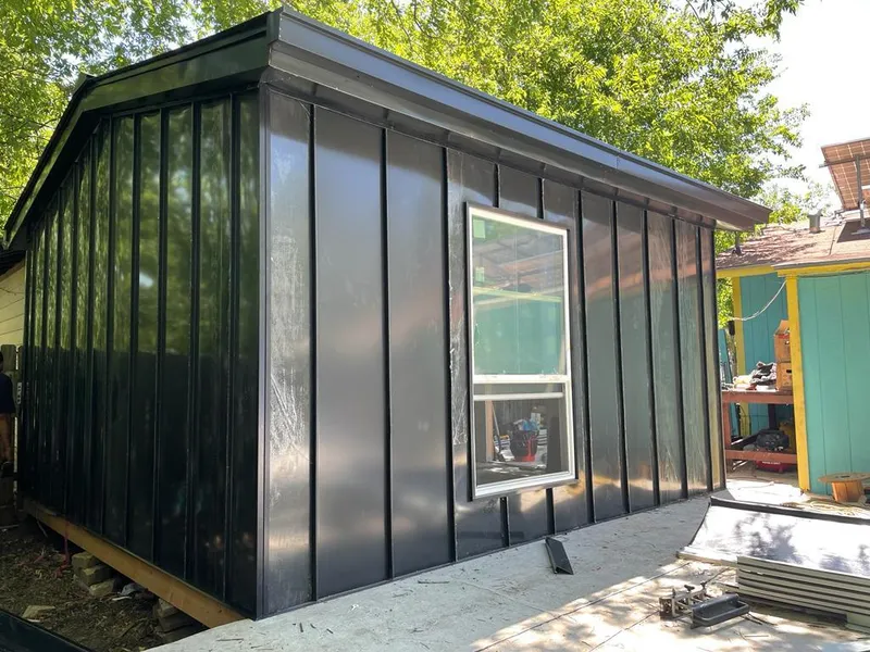 Black standing seam metal wall panels for Roof Inspection in North Olmsted
