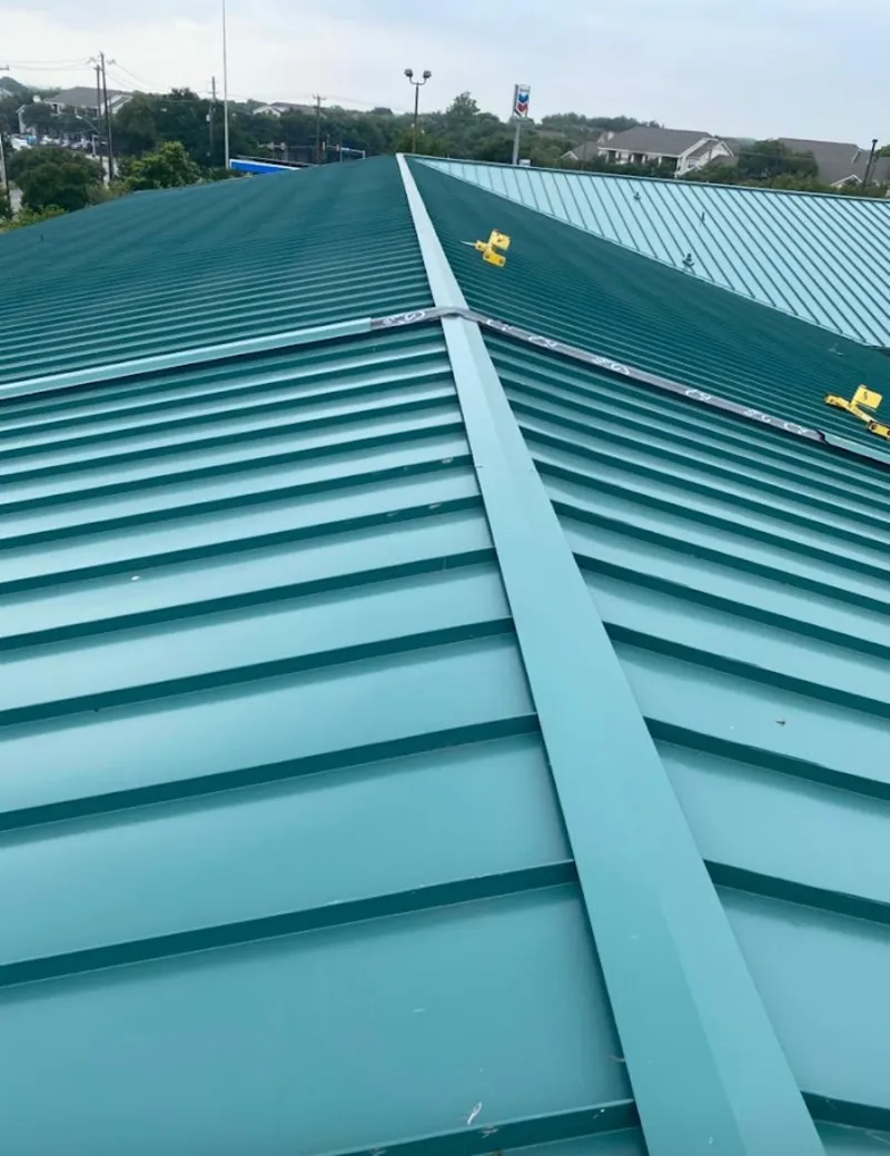 Green commercial metal roof ridge and valley for Metal Roof Repair in North Olmsted