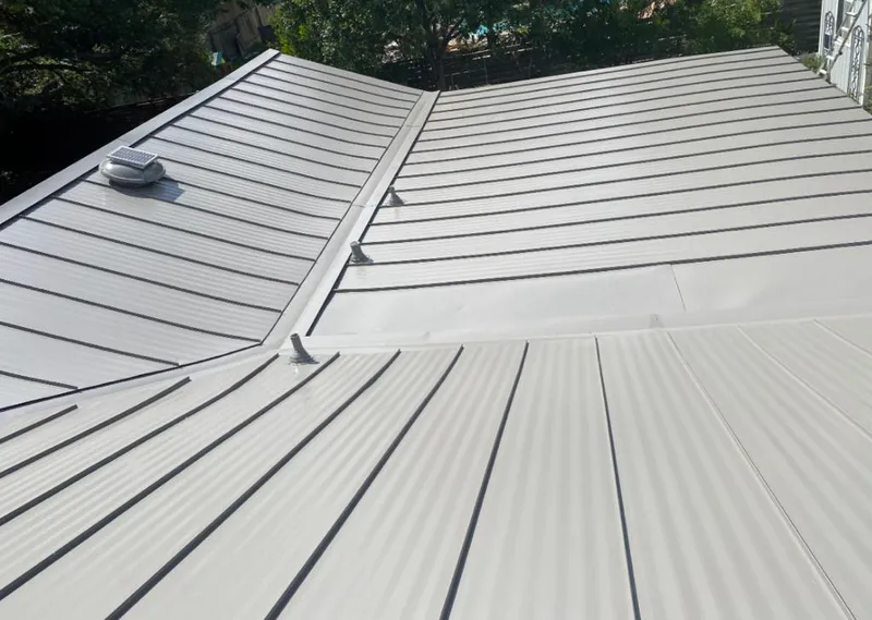 Solar attic fan installed on a metal roof for Roof Ventilation in North Olmsted